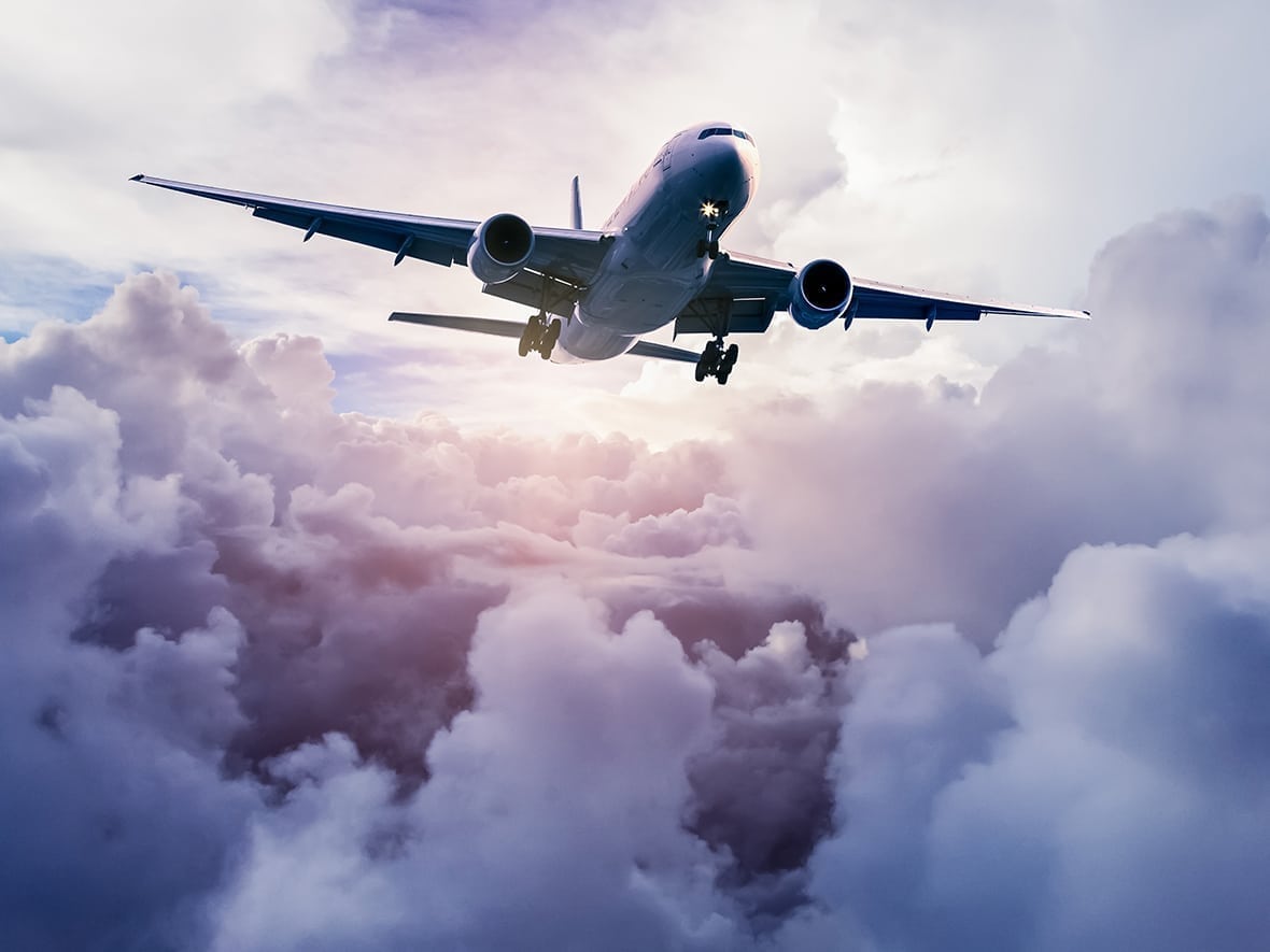 plane flying through clouds