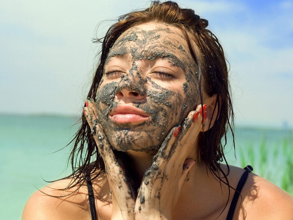 woman applying dead sea mud