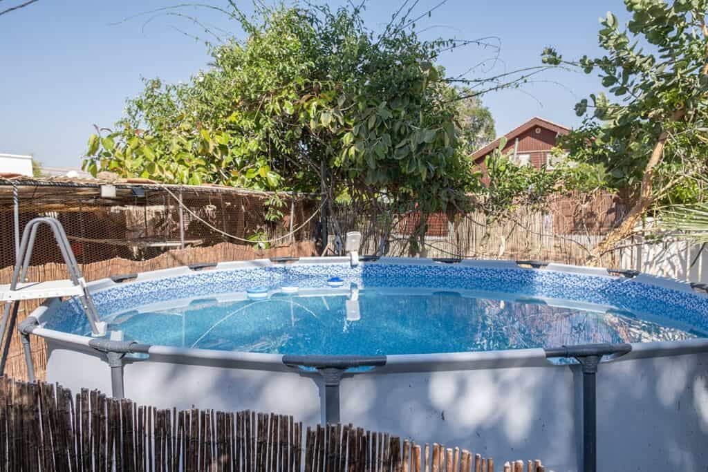 Above-ground swimming pool in the guesthouse courtyard