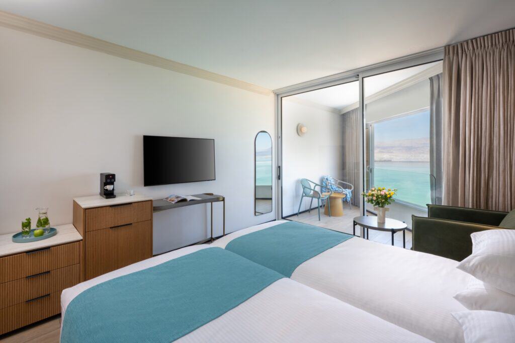 Superior room with twin beds, furnished balcony and Dead Sea view at VERT Dead Sea Hotel