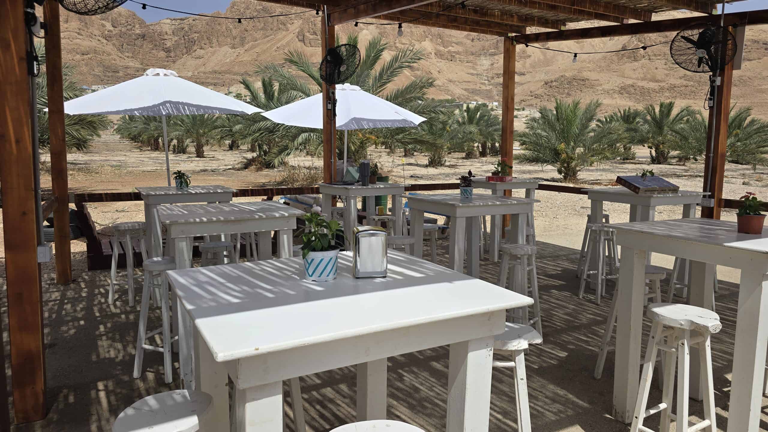 Shaded outdoor seating at Asado BaMidbar